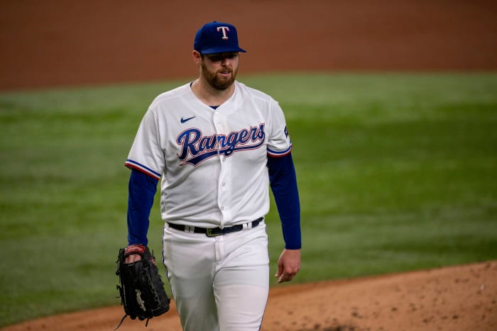 Aug 15, 2023; Arlington, Texas, USA; Texas Rangers starting pitcher Jordan Montgomery (52) walks off the field after pitching against the Los Angeles Angels during the second inning at Globe Life Field. Mandatory Credit: Jerome Miron-USA TODAY Sports